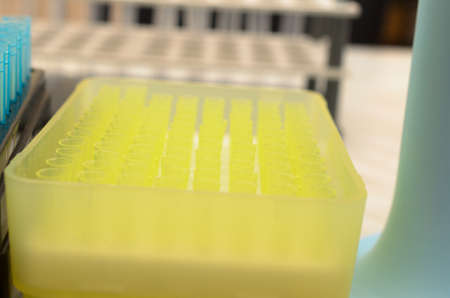 The tubes biochemical laboratory of blue and yellow and transparent glass.