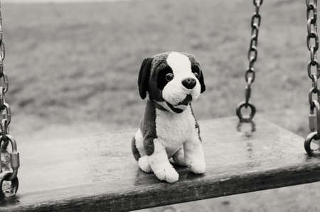 Empty swings. The Lost Child. Black and white image.の写真素材