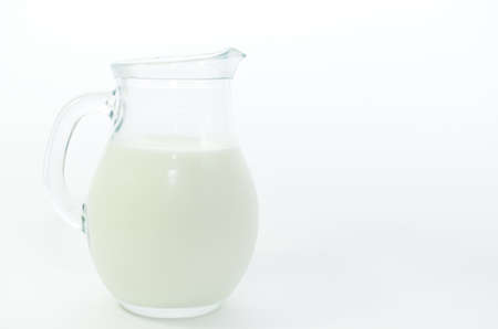 Fresh cow milk in a jar on a light background.の写真素材