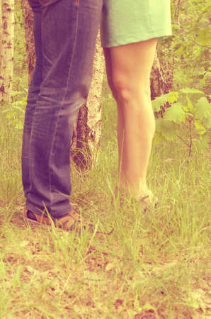 A loving couple man and woman standing kissing on the street.の写真素材