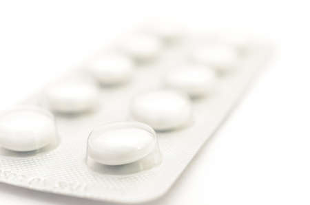 Contraceptive tablets in packages and without on a light background. Preparations of medical purpose.の写真素材