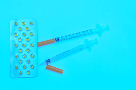 Contraceptive tablets in packages and without on a light background. Preparations of medical purpose.の写真素材