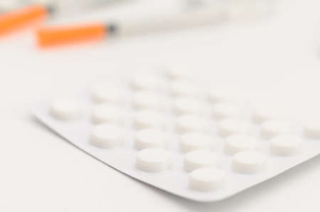 Contraceptive tablets in packages and without on a light background. Preparations of medical purpose.の写真素材