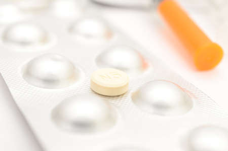 Contraceptive tablets in packages and without on a light background. Preparations of medical purpose.の写真素材