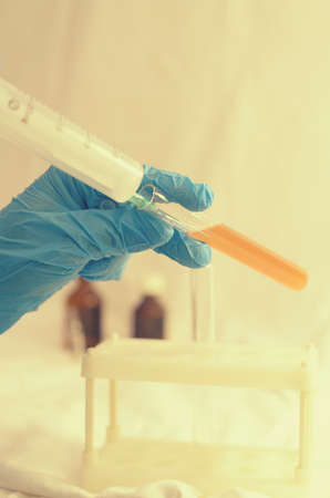 The doctor makes tests with a biological fluid.