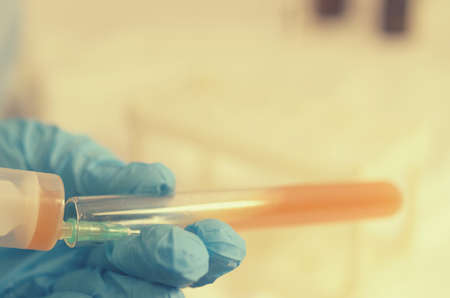 The doctor makes tests with a biological fluid.の写真素材