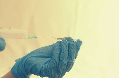 The doctor makes tests with a biological fluid.の写真素材