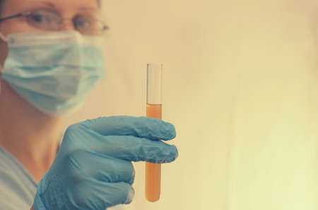 The doctor makes tests with a biological fluidの写真素材