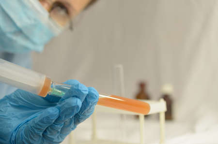 The doctor makes tests with a biological fluid