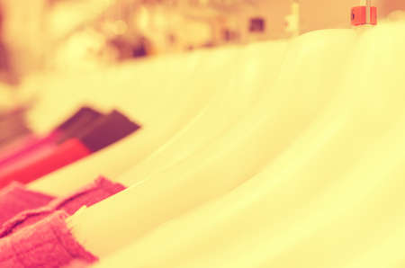 Many hangers in a row for clothes in the store