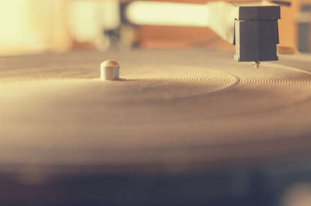 Old dusty record player, complete with radio in idle state.