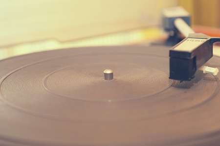 Old dusty record player, complete with radio in idle state.