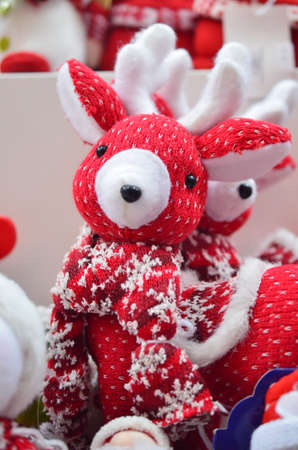 New Year's soft toys against the background of colorful lightsの写真素材