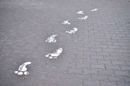 Footprint from the paint on the footpathの写真素材