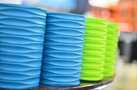 Many new green and blue containers for toothbrushes.の写真素材