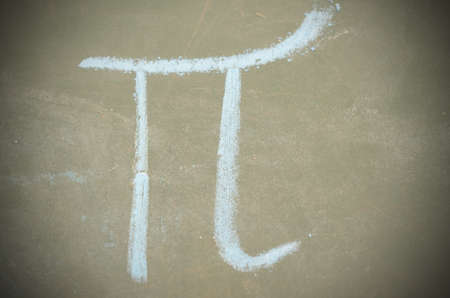 An image of the Pi number on the school board with chalkの写真素材