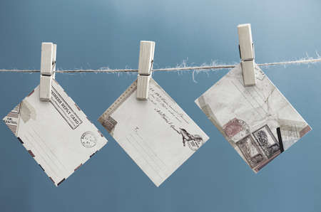 Envelopes of the message on a rope on a blue backgroundの写真素材