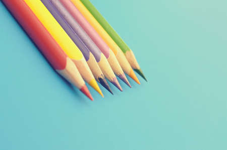 Colorful ground pencils group on a blue backgroundの写真素材