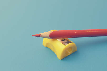 Sharpen the colored pencils with a sharpenerの写真素材