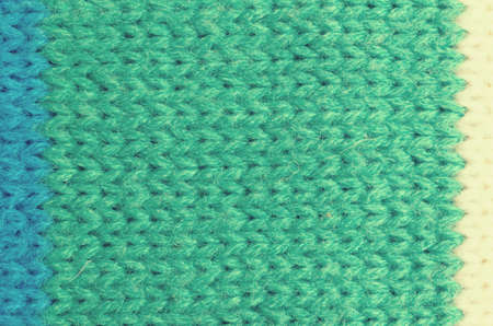 Textile texture of wool. Green, white blue