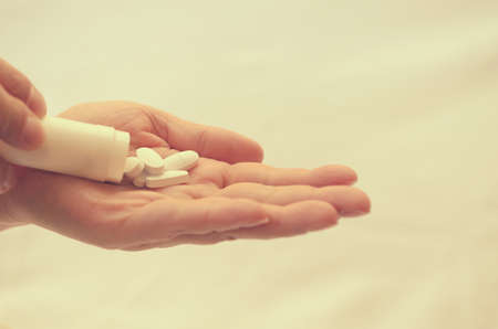 Tablets with a package in the palm of a close-upの写真素材