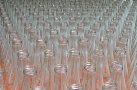 Many empty translucent bottles in a row are perspective