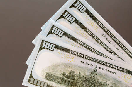 One hundred and fifty dollar bills, spread out in a fanの写真素材