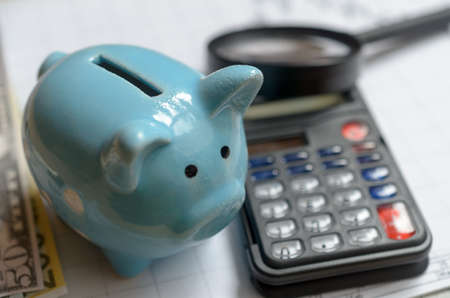The concept of lending. Money, calculator piggy bank