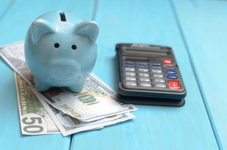 The concept of lending. Money, calculator piggy bank