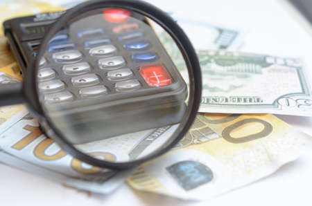 The concept of lending. Money, calculator magnifier
