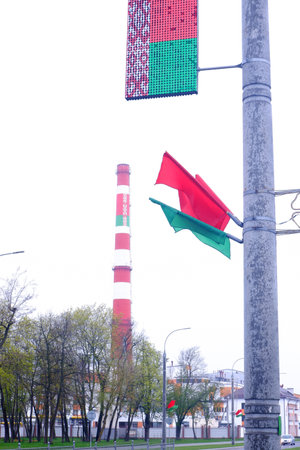 The flag of Belarus on the factory chimney and other state Belarusian symbols.の写真素材