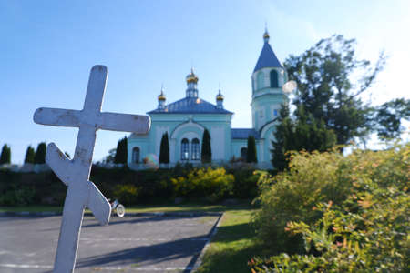 Magnificent turquoise Orthodox church in the rays of the setting sun.のeditorial素材