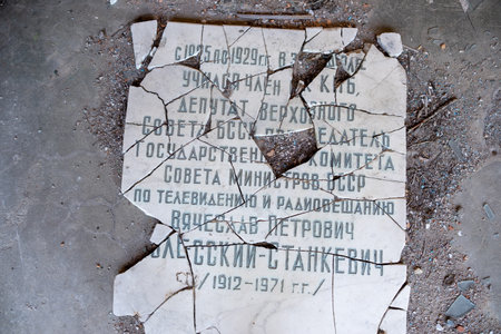Broken rectangular marble name plate in the exclusion zone of Belarus.の写真素材