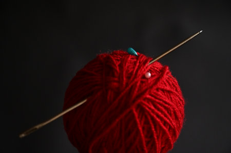 Red ball of thread and needles.の写真素材