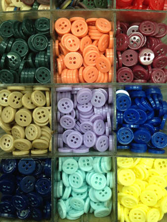 Assorted buttons at a shop in the marketの素材