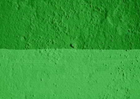The wall is painted in two shades of green.の写真素材