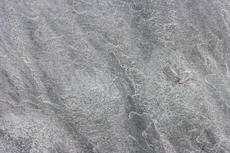 Attractive modern raw and uneven concrete wall surfaceの写真素材