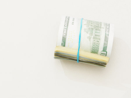 A stack of one hundred dollar bills tied with a blue rubber band on a white background top view.