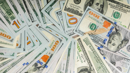Group of money stack of 100 US dollars banknotes.