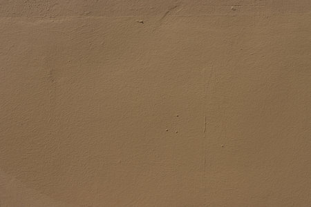 Old wall painted with brown paint. Texture of time-damaged paint. ..Texture for design with copy space.の写真素材