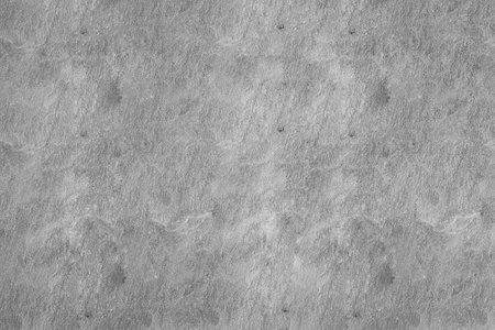 Texture of old gray granite on the wall.の写真素材