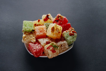 Turkish delight close up. Oriental sweets on a dark background.の写真素材