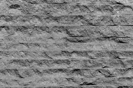 Panorama of modern white, gray stone wall with stripes texture.