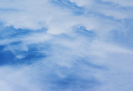 Large gray cloud on a blue, clear sky. Blue sky with gray clouds at daytime.