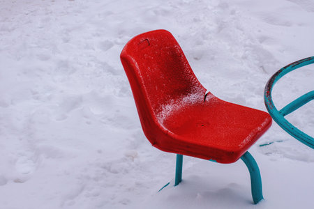 Carousel seat on snow background..Red carousel.. Old carousel seat..の写真素材