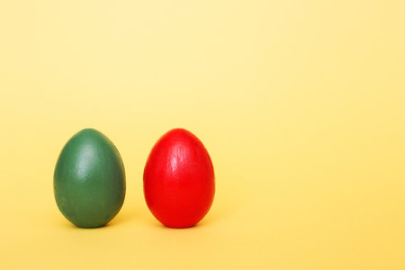 Easter eggs on a yellow paper background. Hand made things.の写真素材