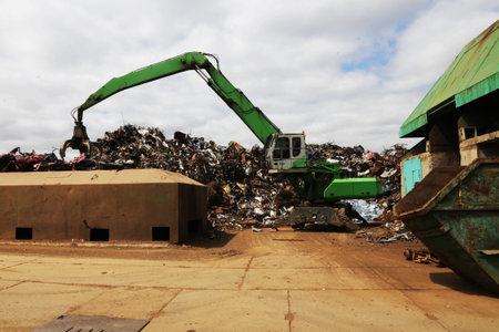 Scrap metal being recycled in junkyard. Ecological concept, metal recycling.の写真素材