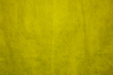 Fabric texture for design with copy space. Yellow abstract background with copy space.の写真素材