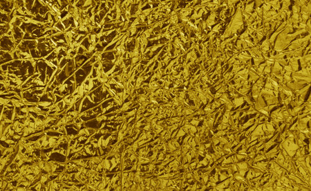 Background for design with copy space. Gold crumpled foil surface.の写真素材