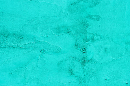 light turquoise or green wall background. beautiful vintage stucco background. abstract cement wall texture.の写真素材